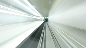 Abstract motion blur inside a modern, illuminated subway tunnel in Nuremberg, Germany. Long exposure shot.