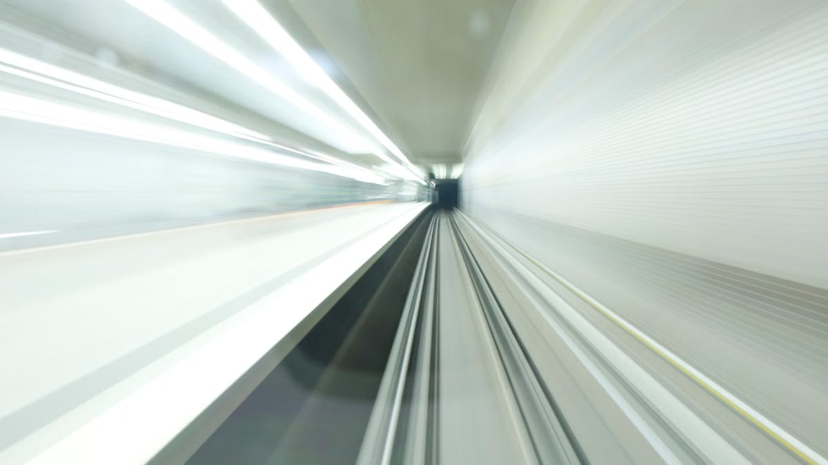 Abstract motion blur inside a modern, illuminated subway tunnel in Nuremberg, Germany. Long exposure shot.